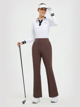 Women's brown 29" flare golf pants, styled with white Titleist polo shirt and visor. #color_Dark Brown