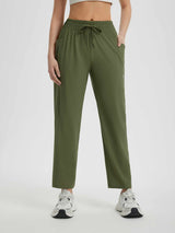Women's running sweatpants in olive green, featuring drawstring waist and secure zipper pocket. #color_Army Green