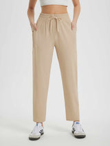 Khaki women's quick-dry running sweatpants with drawstring waist and zip pocket. #color_Khaki