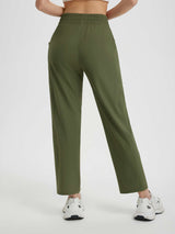 Olive green women's running sweatpants with elastic waistband and reflective ankle details. #color_Army Green