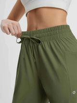 Olive green women's running sweatpants: elastic waistband with drawstring and utility pocket. #color_Army Green