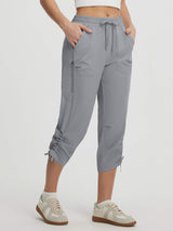 Lightweight grey UPF50+ water-resistant hiking capris with pockets & adjustable ankles. #color_Light Gray