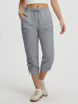 Grey UPF50+ water-resistant hiking capris with adjustable cinched ankles #color_Light Gray