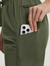 Olive green UPF50+ hiking capris with hand placing smartphone in side pocket. #color_Army Green