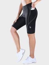 Woman wearing black 9-inch UPF 50+ padded cycling shorts with side phone pocket. #color_Dark Gray