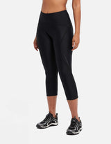 Black women's UPF 50+ padded 3/4 cycling capris with reflective side detail. #color_Black