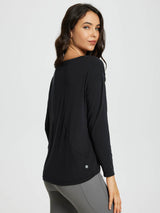 Black women's long-sleeve workout t-shirt with boat neck and curved hip-length hem, worn with grey leggings. #color_Black