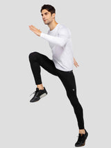 Men's black fleece-lined winter cycling tights with ankle zippers in motion #color_Black