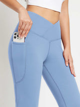 Blue crossover waist fleece yoga flare pants with phone pocket.