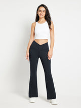 Black crossover waist fleece yoga flare pants with V-seam detail #color_Black