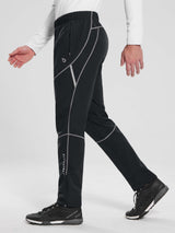 Elastic waist fleece mountain pants for men in black, with zip pockets & reflective details.