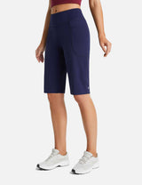 Navy Flyleaf women's 12-inch high-waisted running shorts with side pockets.