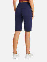 Navy blue women's high-waisted running shorts with pockets, showing back view.