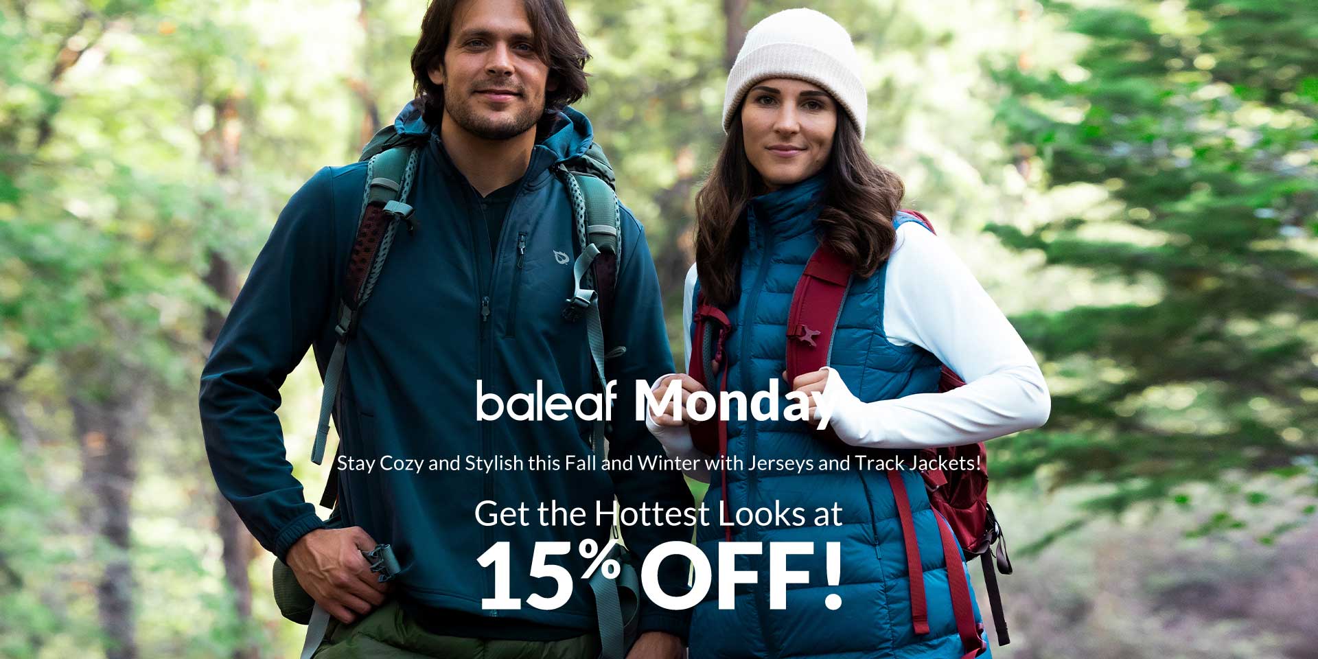Male and female hikers wearing jackets and backpacks during a fall and winter clothing promotion