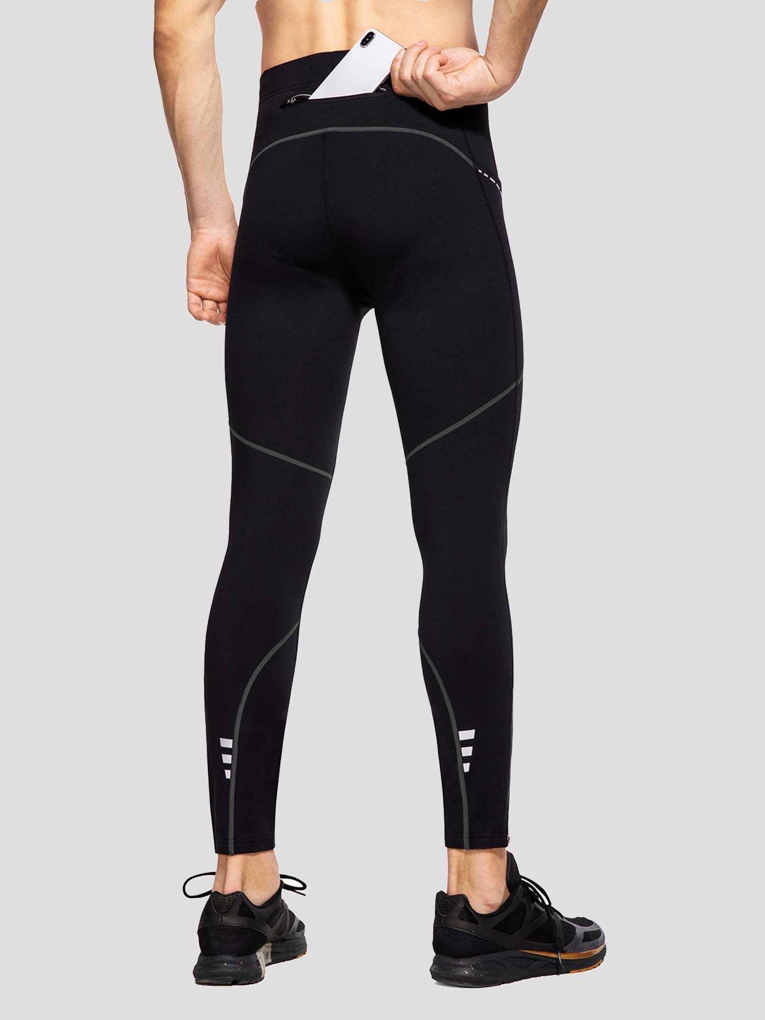 Men's winter cycling tights, black, fleece-lined, featuring rear phone pocket and reflective ankle accents. #color_Dark Gray