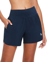 Navy blue 5" quick-dry running shorts with high-rise waist, pockets, and side slits. #color_Navy Blue