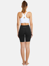 Baleaf black 7" yoga high waist comfort shorts with pockets, showcasing a woman from the back. #color_Black