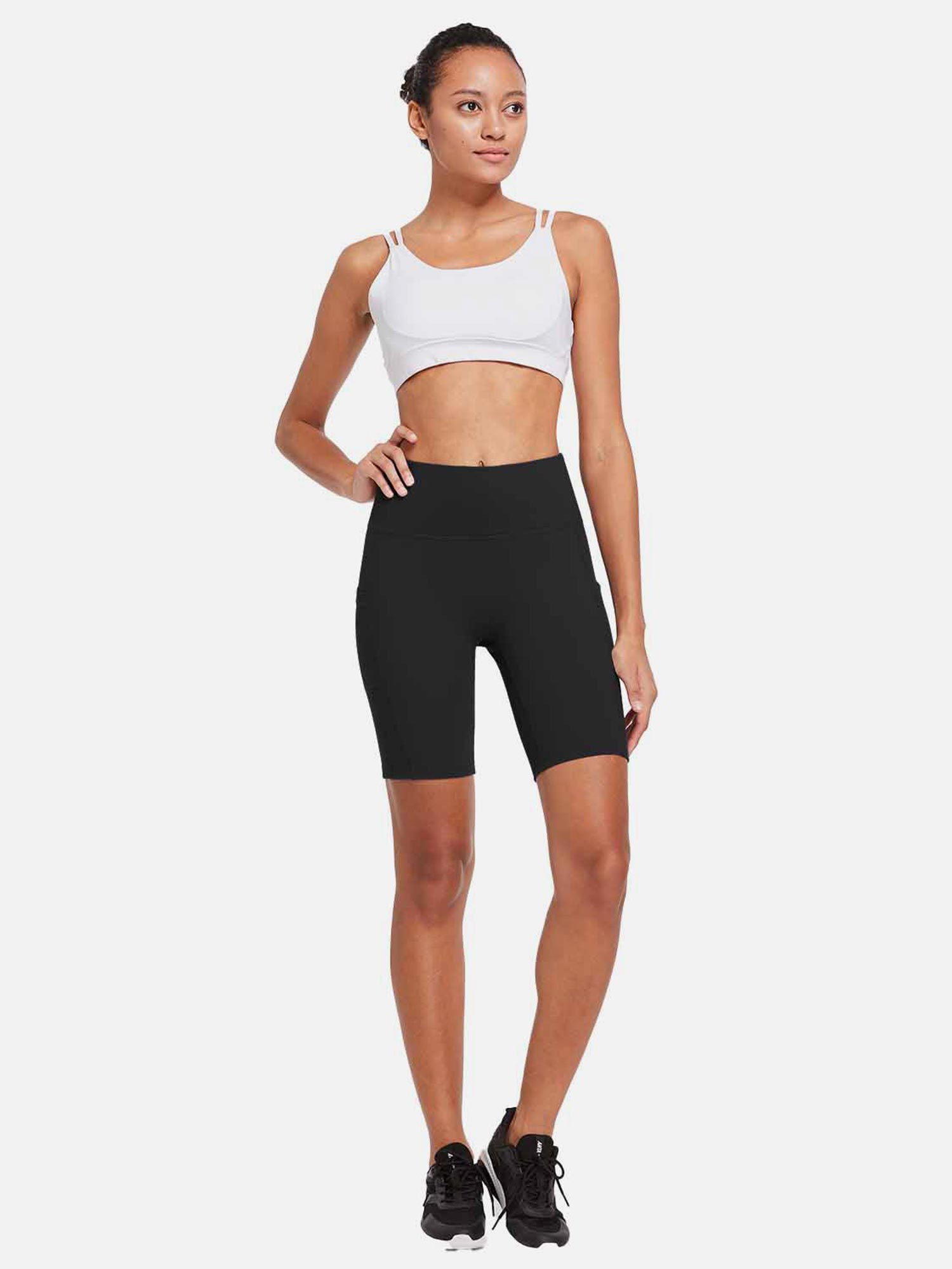 Women's black 8" high-waisted compression yoga biker shorts with side pockets. #color_Black