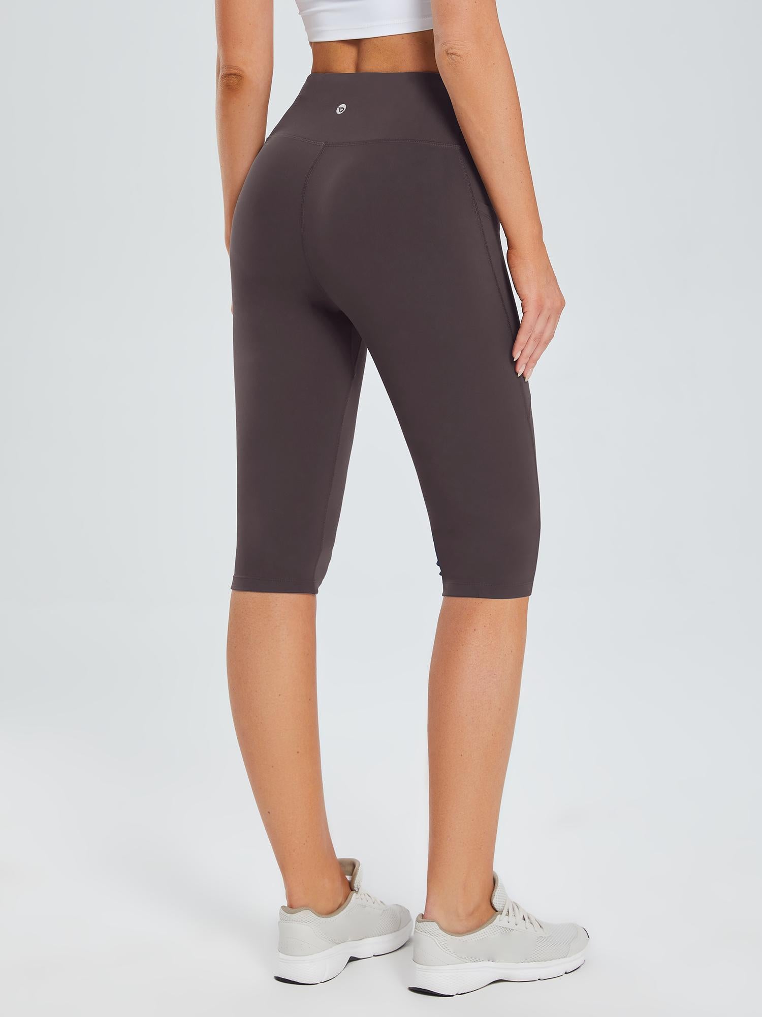 Women's dark gray plus size knee-length capris with a high waistband and pockets, shown from the back. #color_Dark Brown