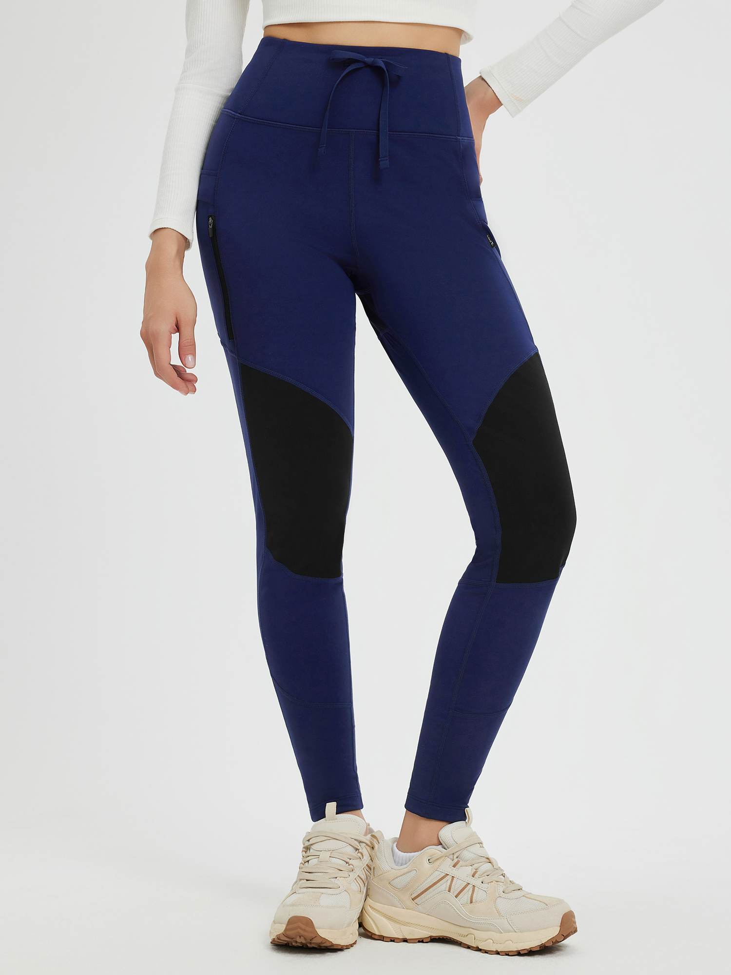 Navy blue knit fleece outdoor pants with black panels, multi-zipper pockets & drawstring. #color_Dark Blue/Black