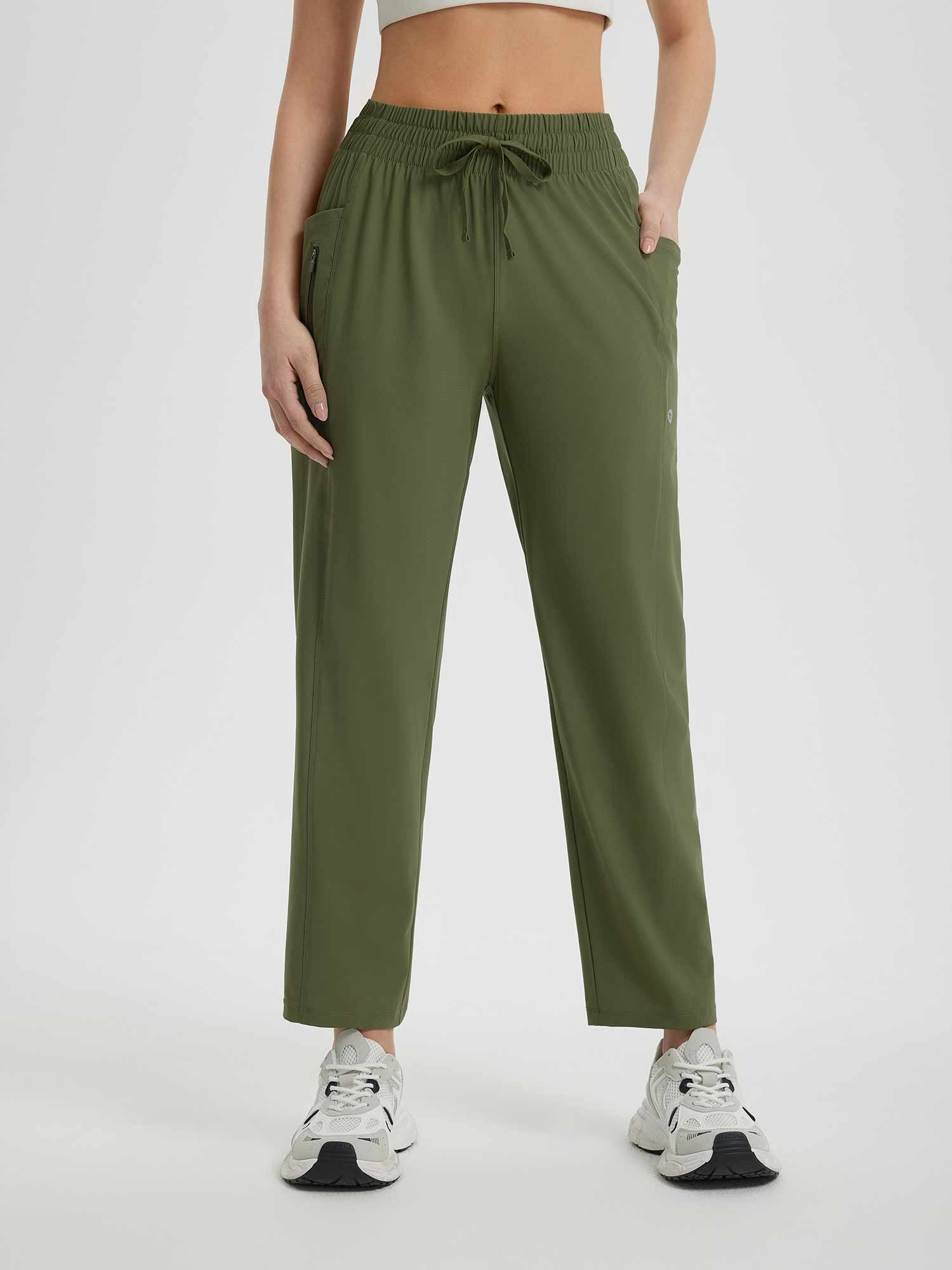 Women's running sweatpants in olive green, featuring drawstring waist and secure zipper pocket. #color_Army Green