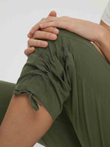 Women's UPF 50+ hiking capris with adjustable ruched ankle ties. #color_Army Green