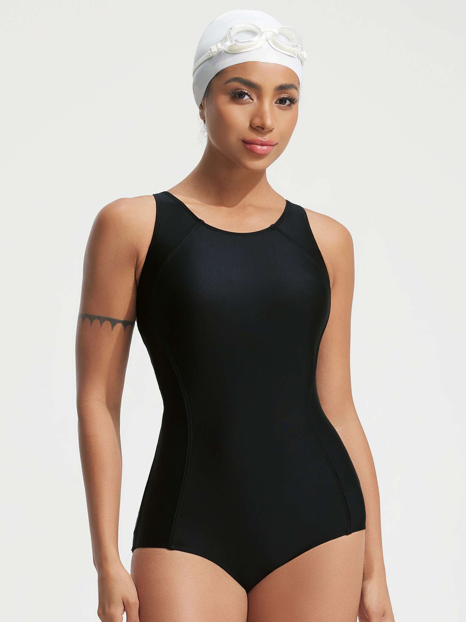 Black modest one-piece racerback swimsuit with tummy control and high neckline. #color_Black