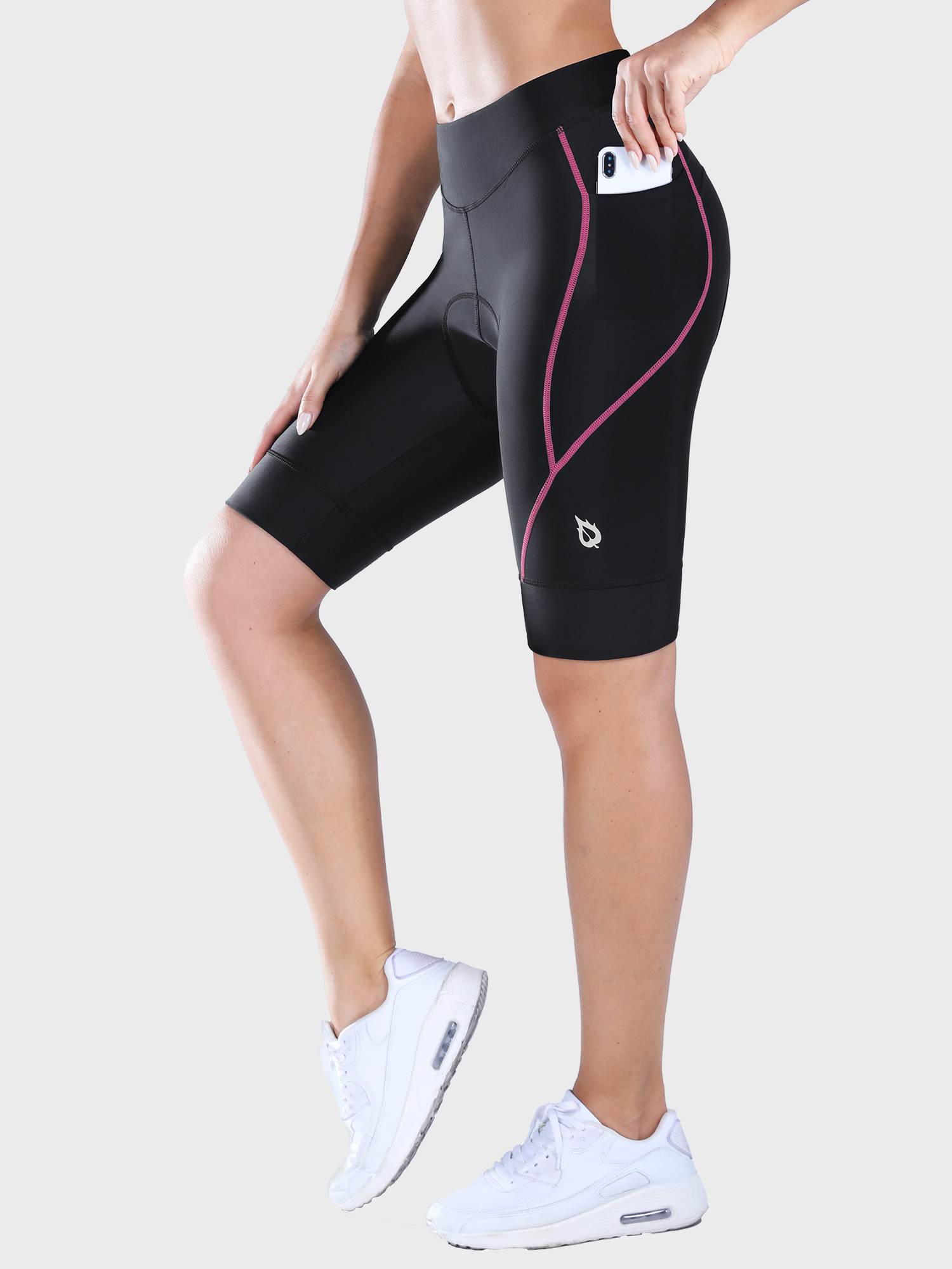 Women's black padded cycling shorts with pink seam detail and phone pocket #color_Pink
