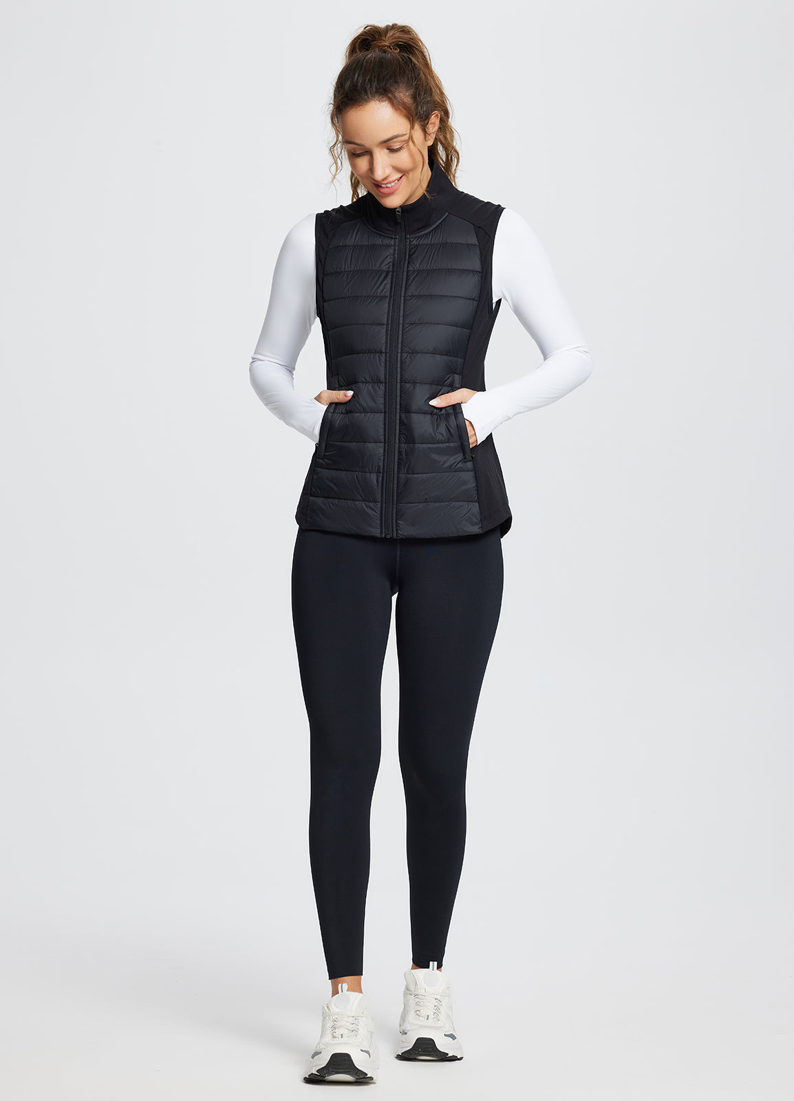 Black slim-fit quilted puffer vest for running #color_Black