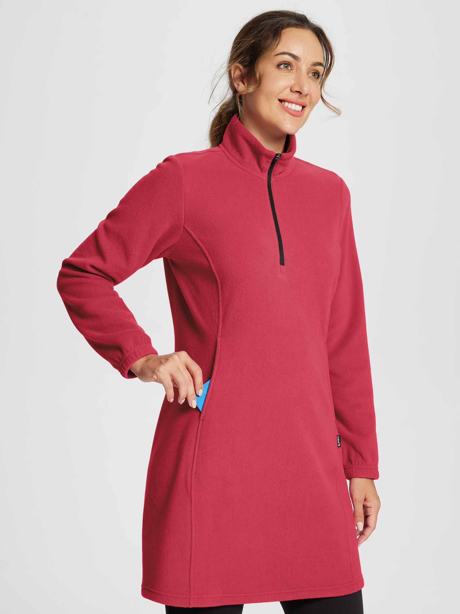 Woman in red quarter zip fleece tunic dress with kangaroo pocket.  #color_Lava Falls