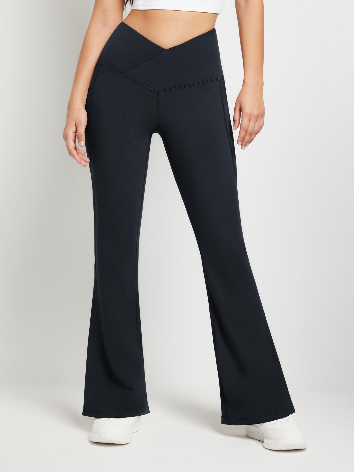 Crossover waist navy fleece yoga flare pants with V-seam and pockets. #color_Black