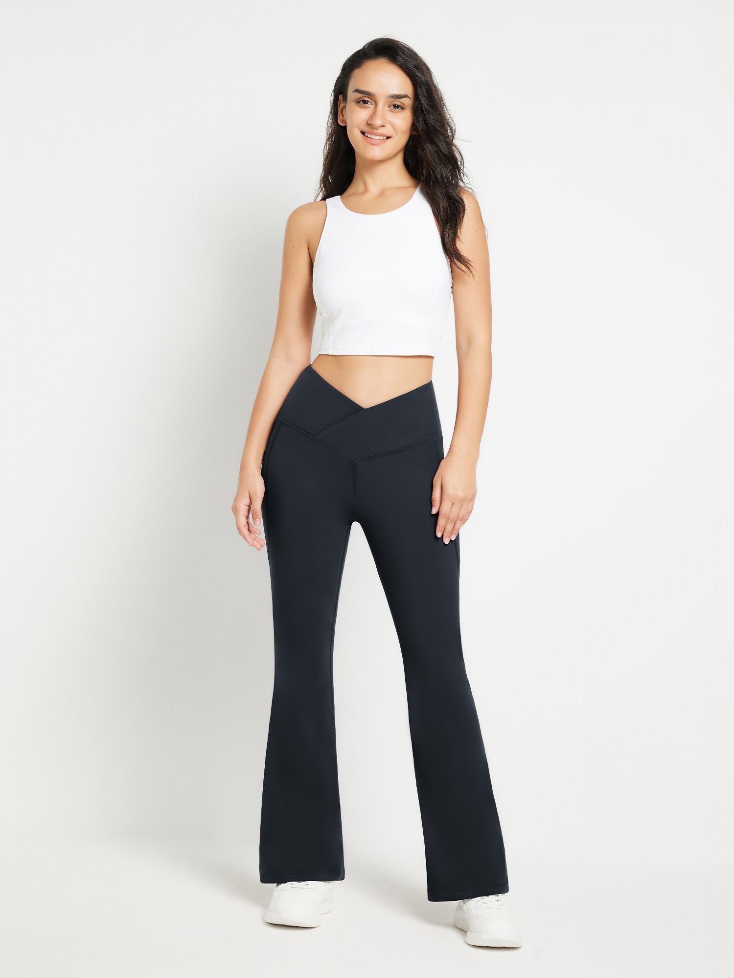 Black crossover waist fleece yoga flare pants with V-seam detail #color_Black