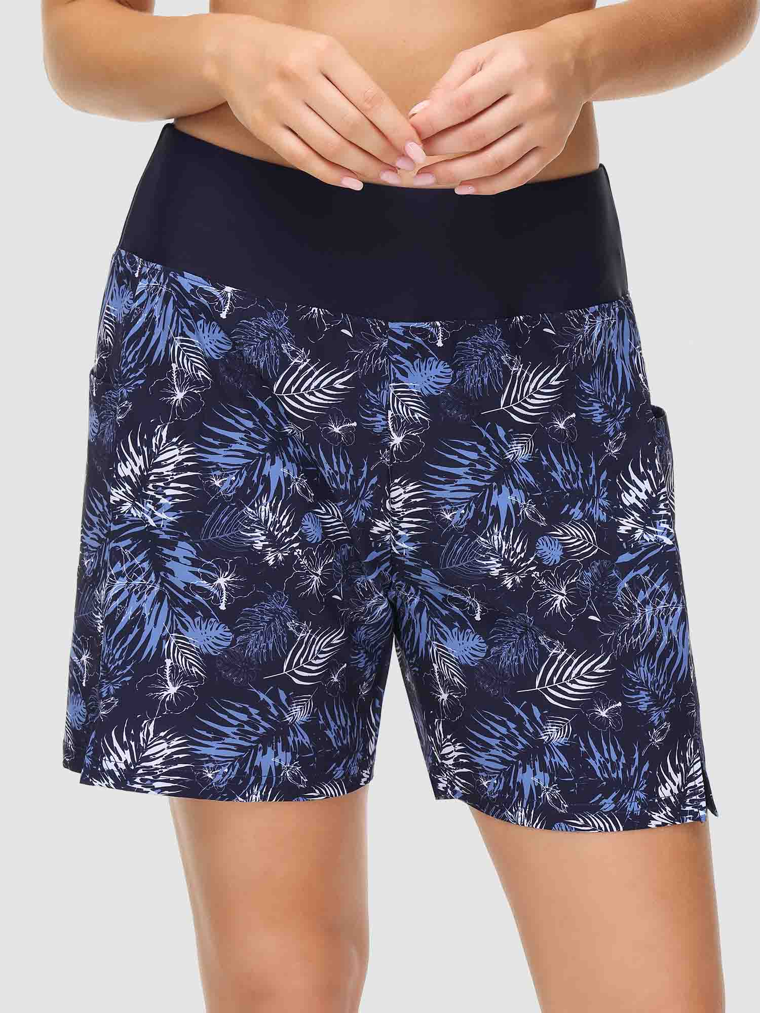 Women's printed quick-dry swim shorts, 5" inseam, navy tropical pattern.