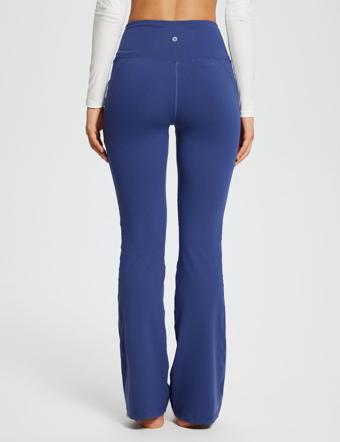 Laureate Women's 29" Navy Blue Crossover High-Waisted Flare Yoga Pants with pockets. #color_Navy Blue