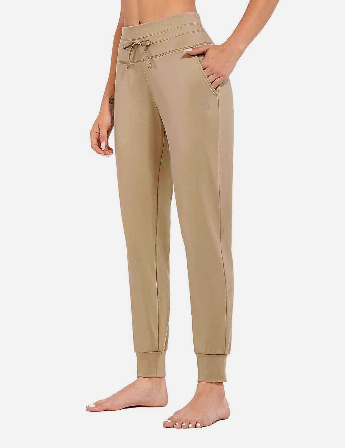 Beige Laureate Thermal Tapered Joggers with drawstring waist and side pockets. #color_Doeskin