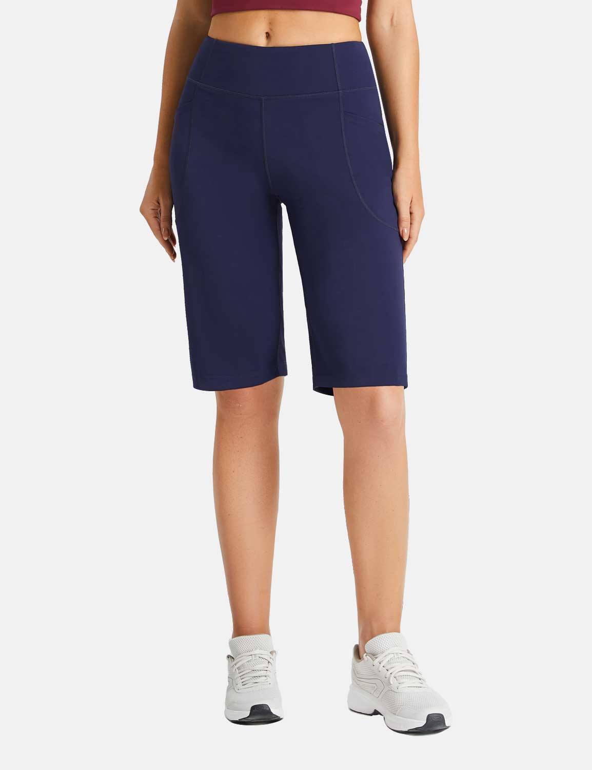 Navy Flyleaf women's 12" running shorts with high waist and 3 pockets. Stretchy, breathable fabric.